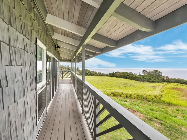 a view of a balcony with ocean view