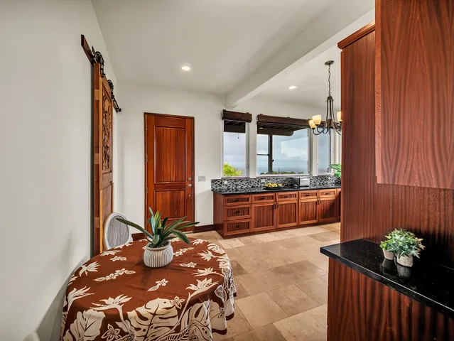 a bedroom with a bed and a mirror