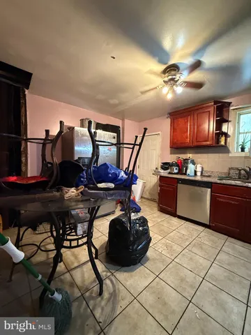 a kitchen with stainless steel appliances granite countertop a stove and a refrigerator