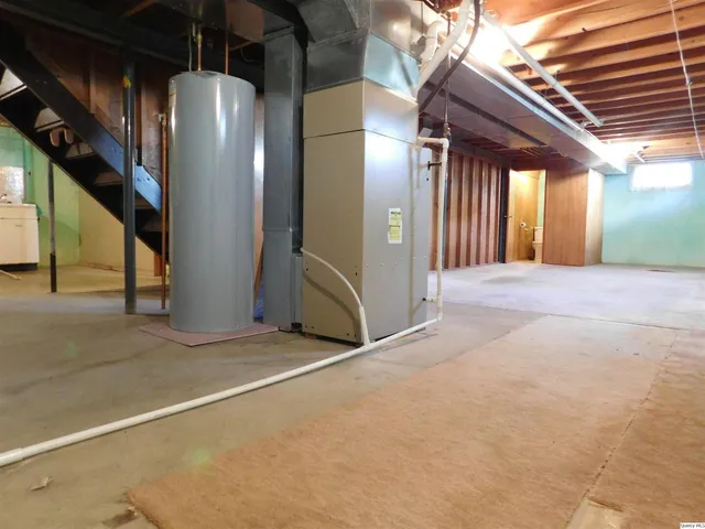 a view of an empty room with stairs