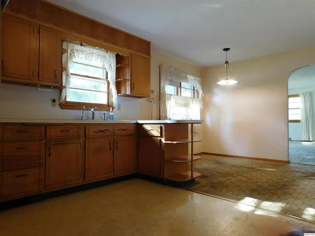a kitchen with sink and window