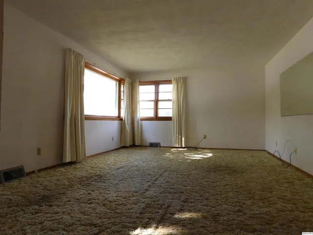 an empty room with windows