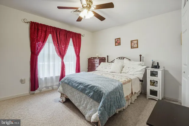 a bedroom with a bed and a table