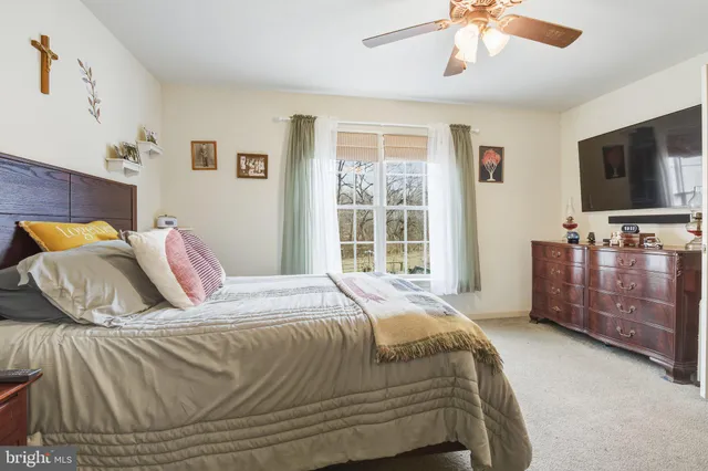 a bathroom with a sink mirror and toilet
