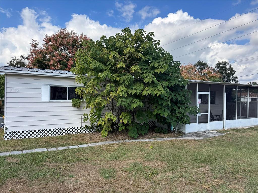 3402 Pearson Road Valrico, FL 33596 - Photo 1 of 24 a front view of a house with a yard