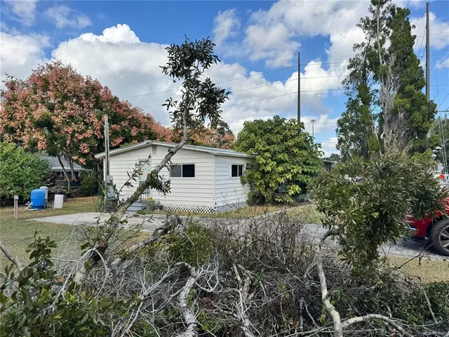 a view of a backyard of the house