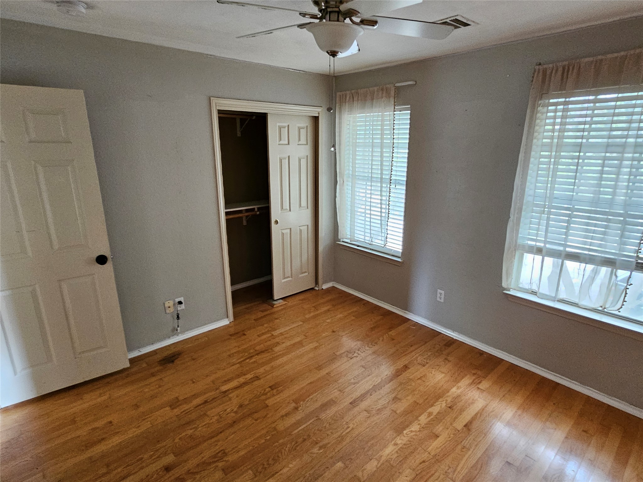 4672 Mather Kyle, TX 78640 - Photo 14 of 28 a view of an empty room with a window and wooden floor