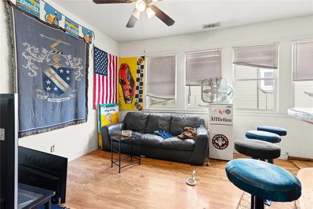 a living room with furniture and a large window