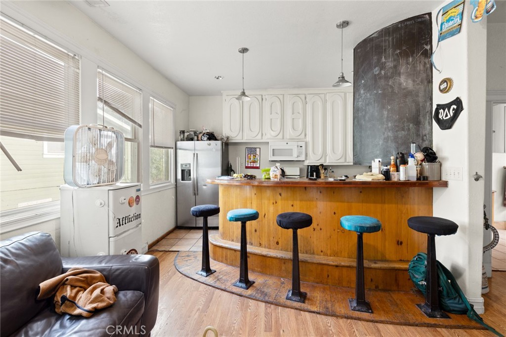 831 Rio Chico Way Chico, CA 95928 - Photo 9 of 13 a kitchen with stainless steel appliances granite countertop a sink a stove and a refrigerator