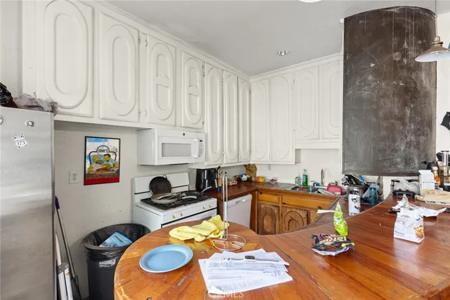 a living room with furniture a rug and a fireplace