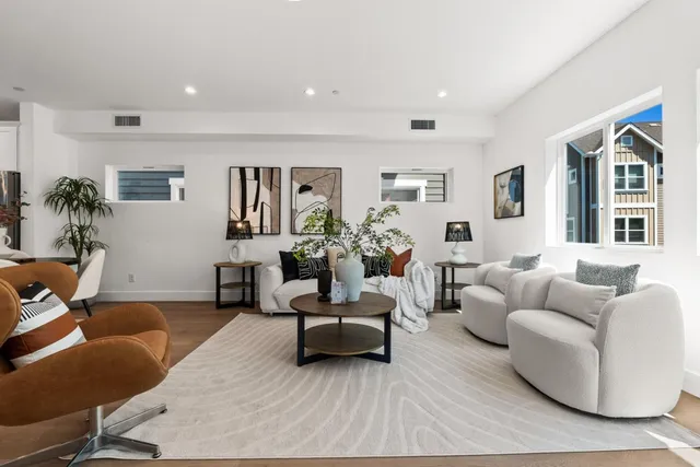 a bedroom with a bed and a night stand