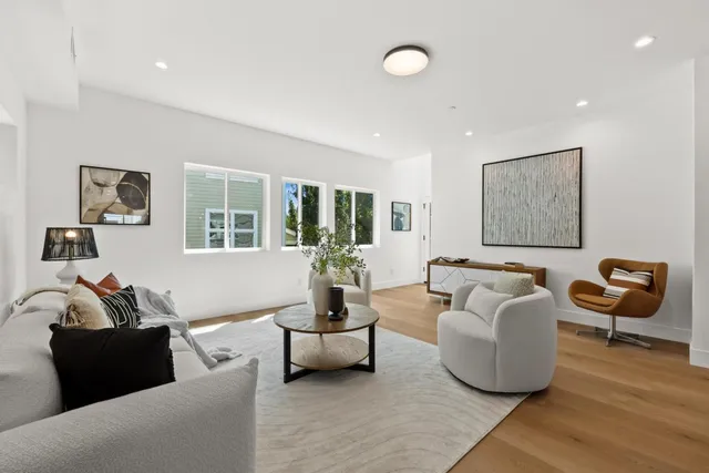 a bathroom with double vanity sink a mirror and shower