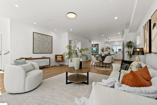 a bathroom with a double vanity sink mirror and shower