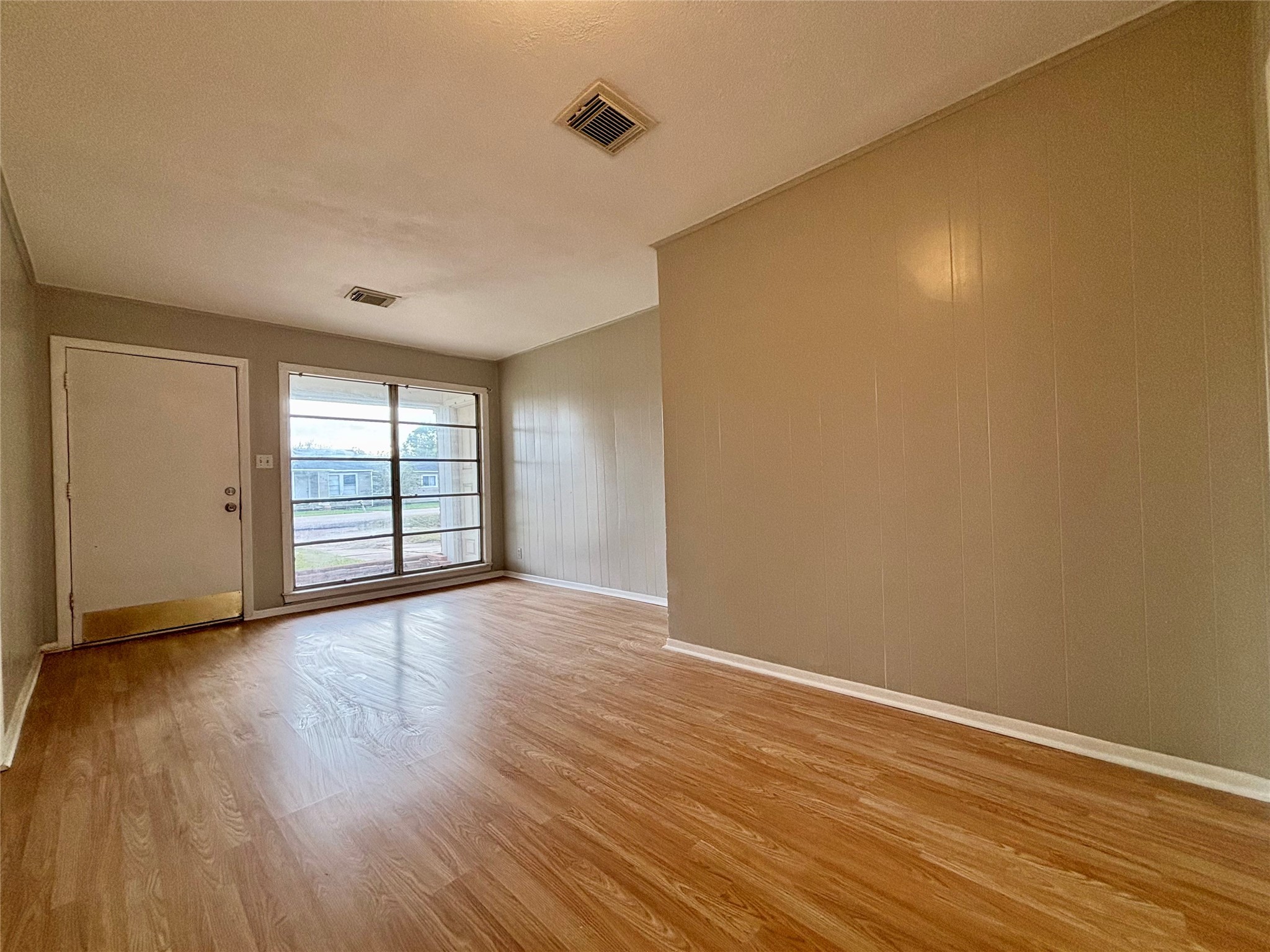 706 West 7th Street Freeport, TX 77541 - Photo 3 of 22 a view of wooden floor and windows in a room