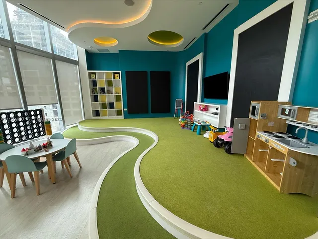 a swimming pool with outdoor seating and yard