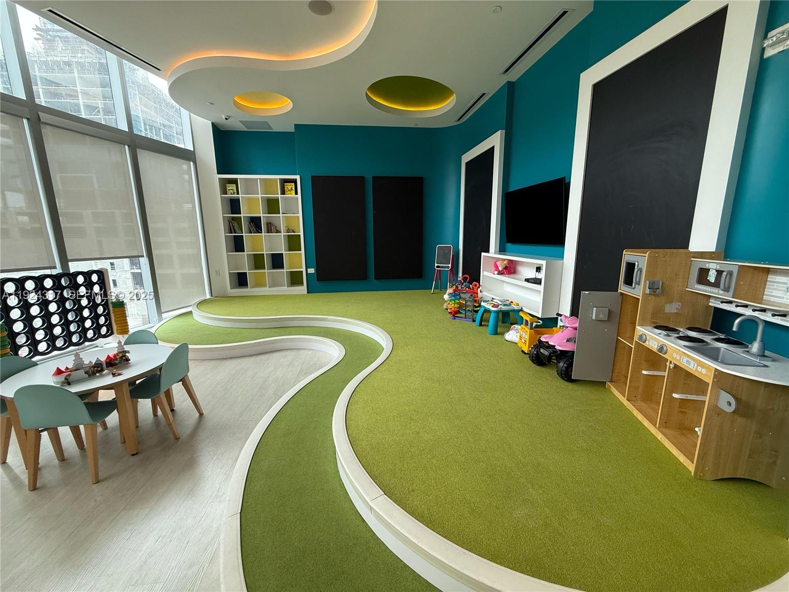 851 Northeast 1st Avenue, Unit 4811 Miami, FL 33132 - Photo 24 of 30 a swimming pool with outdoor seating and yard