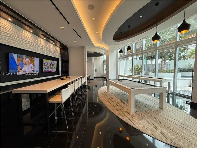 a very nice looking dining room with furniture