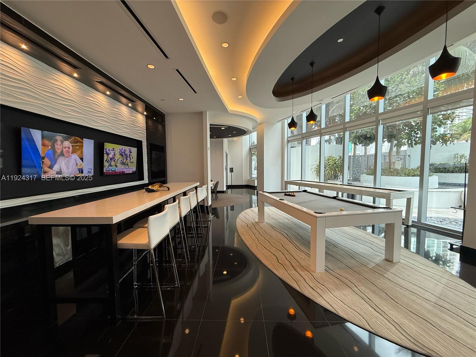 851 Northeast 1st Avenue, Unit 4811 Miami, FL 33132 - Photo 27 of 30 a very nice looking dining room with furniture