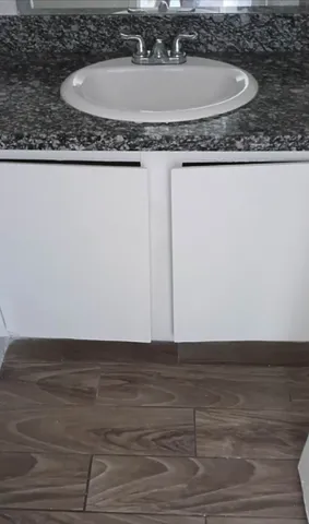 a view of hallway with wooden floor