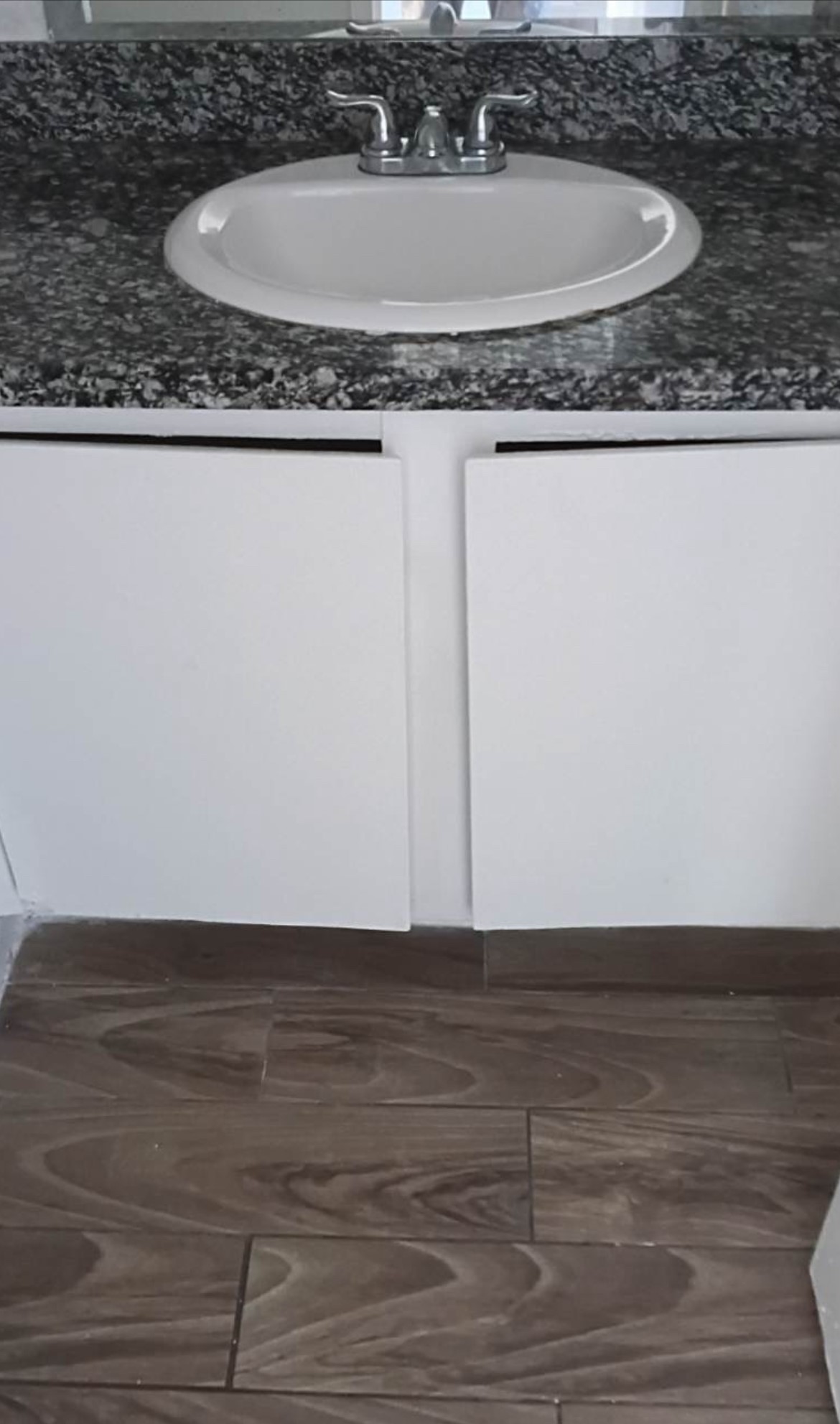 6200 West Tidwell Road, Unit 2306 Houston, TX 77092 - Photo 14 of 15 a bathroom with a granite countertop sink and a mirror