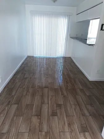 a view of entryway with wooden floor