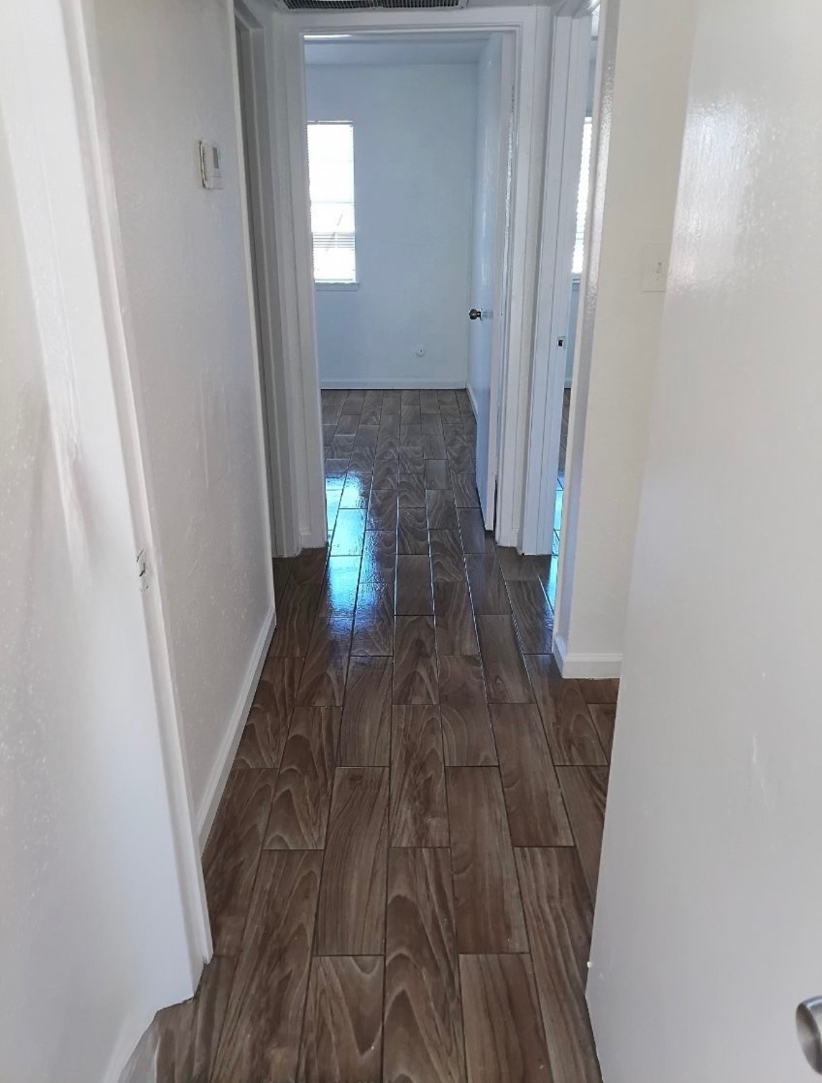 6200 West Tidwell Road, Unit 2306 Houston, TX 77092 - Photo 8 of 15 a view of entryway with wooden floor