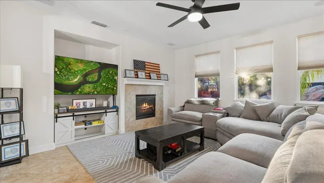 a living room with furniture and a large window