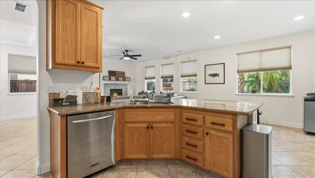 a bathroom with a sink vanity mirror and toilet
