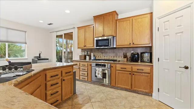 a spacious bedroom with a bed and a window