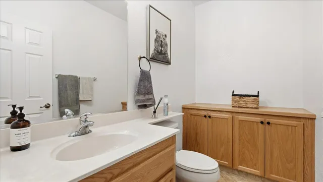 a view of a bedroom with a dishwasher and a window