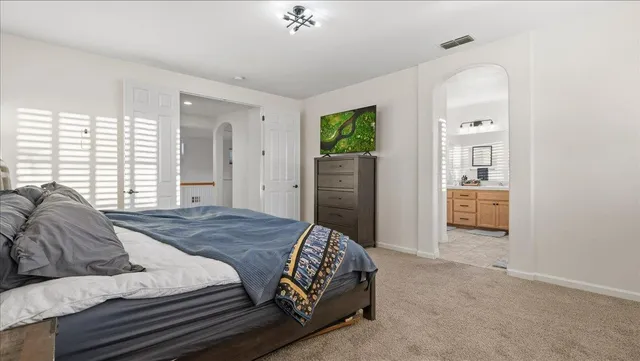 a bathroom with double sink and a mirror
