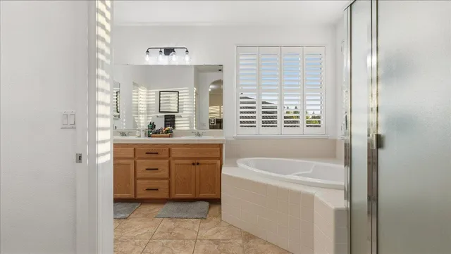 a bathroom with a bathtub and a shower