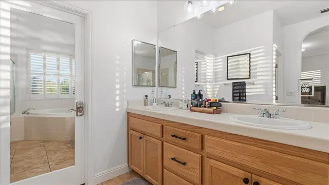 a view of a kitchen with wooden floor and cabinets