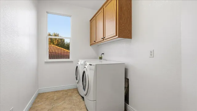 a view of a patio with couches table and chairs potted plants and palm tree
