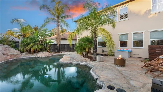 an aerial view of residential houses with city view