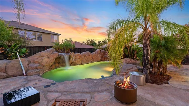 a view of swimming pool with outdoor seating