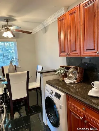 a view of a kitchen area with furniture and a window