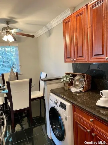 a view of a kitchen area with furniture and a window