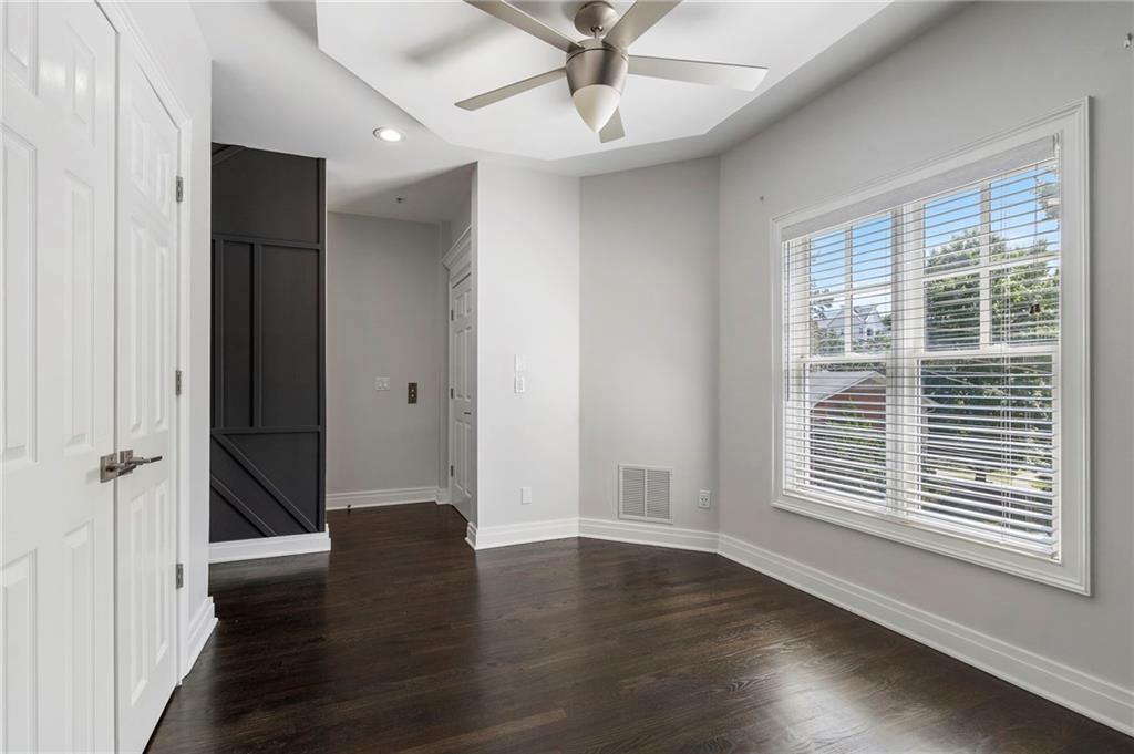 3541 Roswell Road Northeast, Unit 4 Atlanta, GA 30305 - Photo 11 of 45 wooden floor in an empty room with a window
