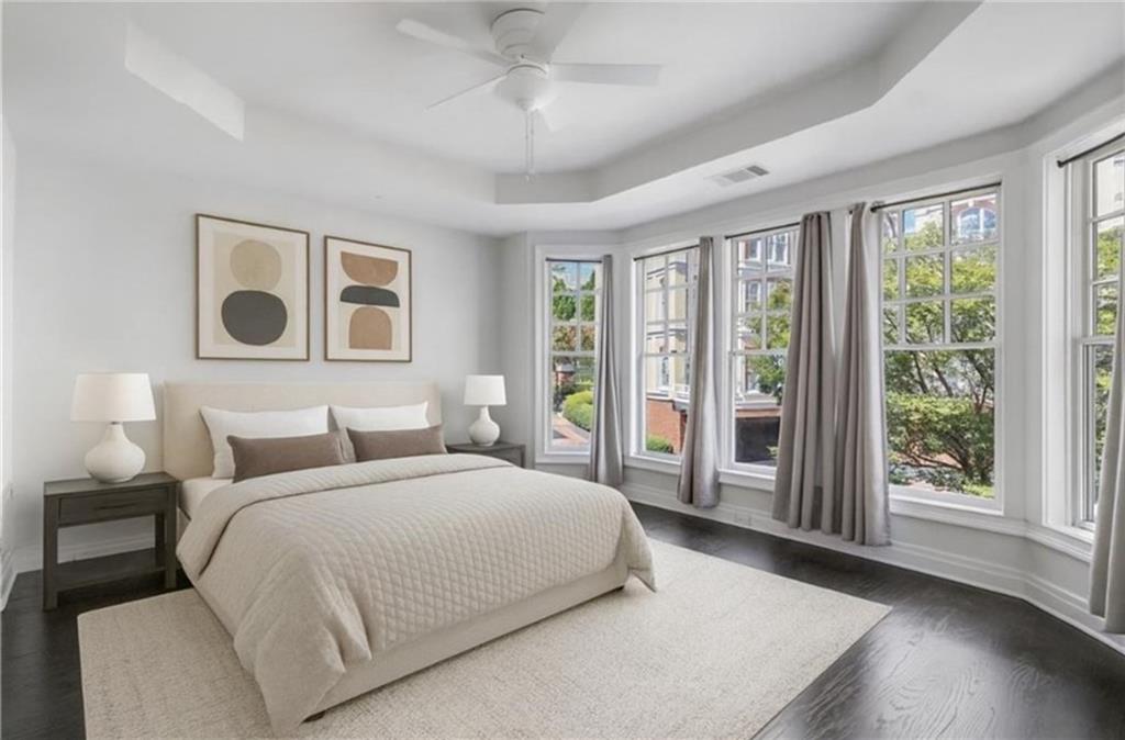 3541 Roswell Road Northeast, Unit 4 Atlanta, GA 30305 - Photo 12 of 45 a bedroom with a large bed and a large window