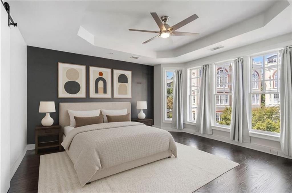 3541 Roswell Road Northeast, Unit 4 Atlanta, GA 30305 - Photo 19 of 45 a bedroom with a large bed and a large window
