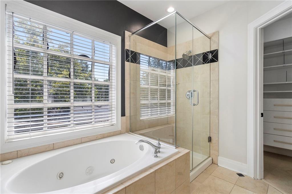 3541 Roswell Road Northeast, Unit 4 Atlanta, GA 30305 - Photo 25 of 45 a bathroom with a bathtub and a shower