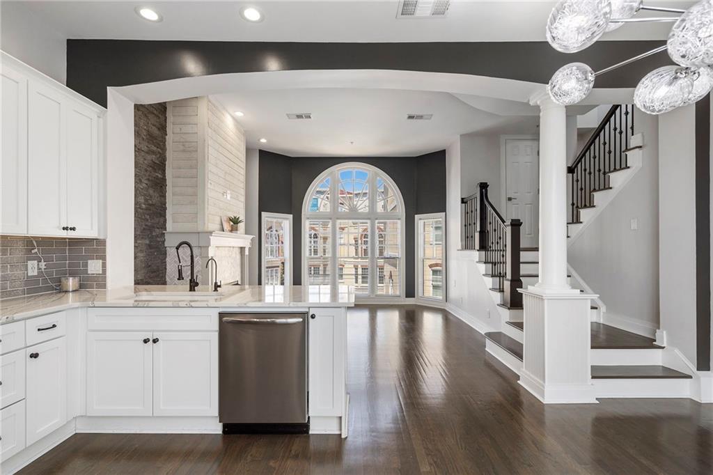 3541 Roswell Road Northeast, Unit 4 Atlanta, GA 30305 - Photo 29 of 45 a view of a kitchen with a sink and wooden floor