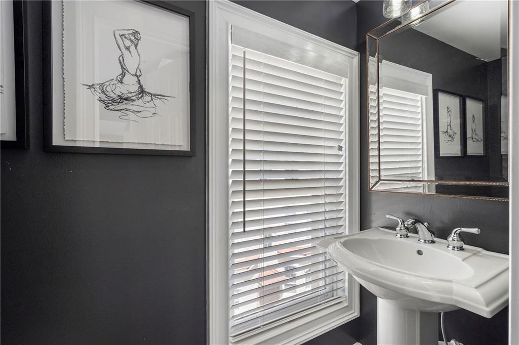 3541 Roswell Road Northeast, Unit 4 Atlanta, GA 30305 - Photo 37 of 45 a bathroom with a sink and a mirror