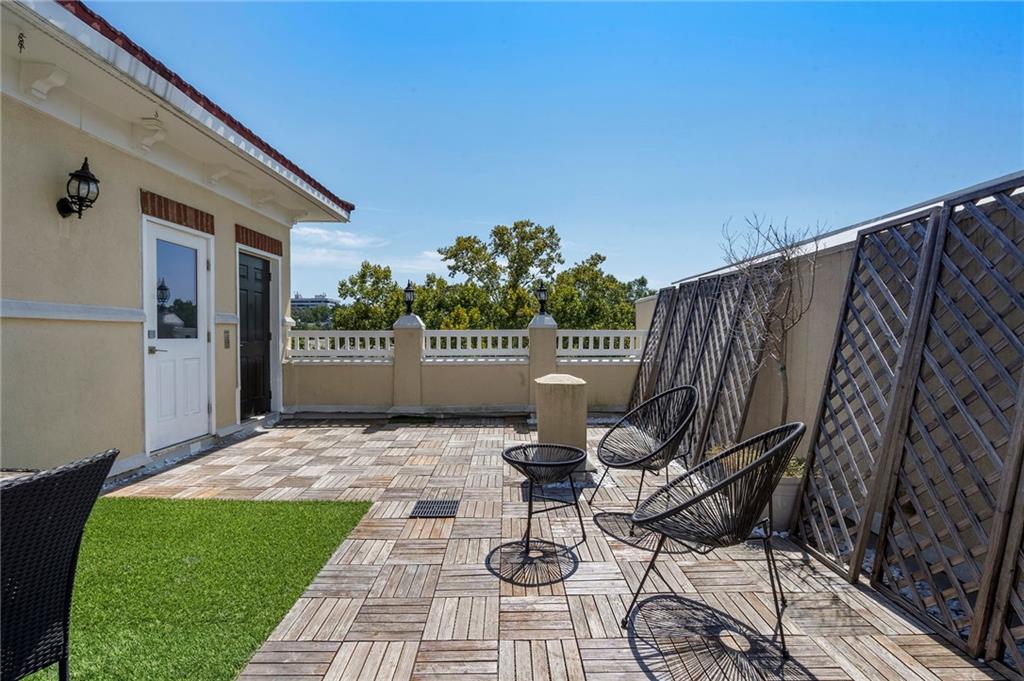 3541 Roswell Road Northeast, Unit 4 Atlanta, GA 30305 - Photo 43 of 45 a patio with glass top table and chairs