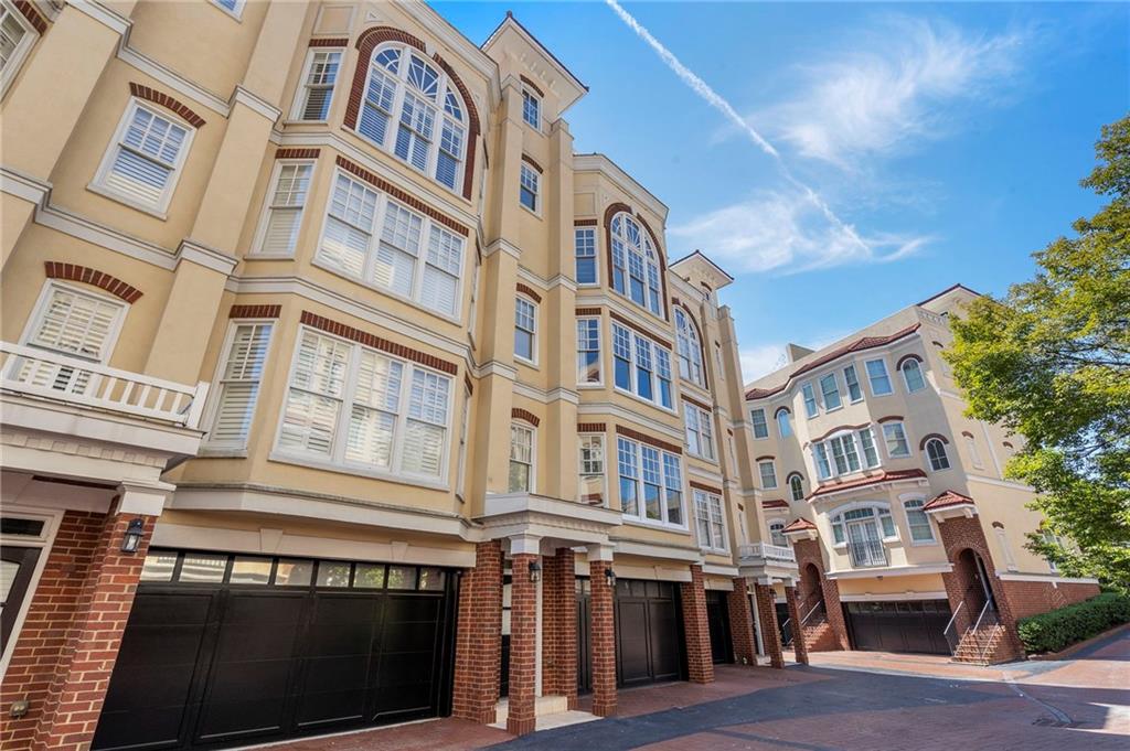 3541 Roswell Road Northeast, Unit 4 Atlanta, GA 30305 - Photo 5 of 45 a front view of a brick building with many windows