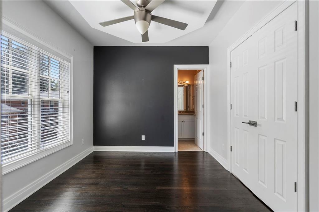 3541 Roswell Road Northeast, Unit 4 Atlanta, GA 30305 - Photo 10 of 45 wooden floor in an empty room with a window