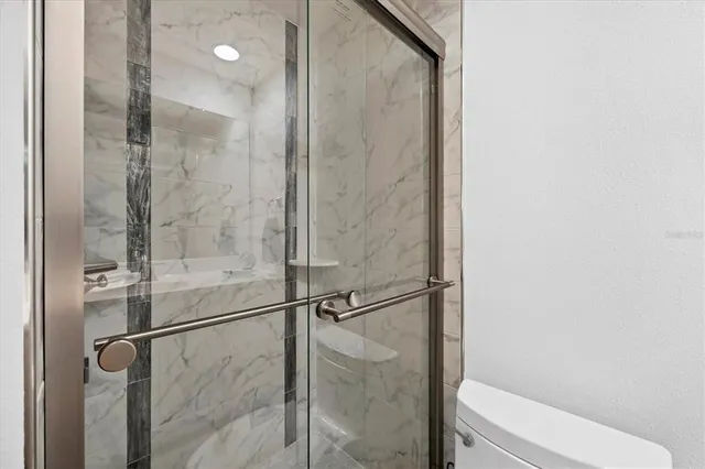 a view of a house with swimming pool and sitting area