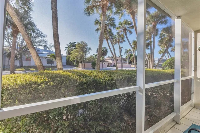 a vase of flowers sitting on a floor