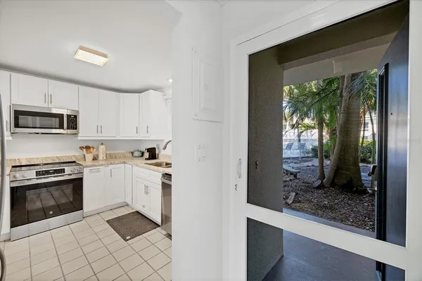 a kitchen with a stove a sink and a refrigerator